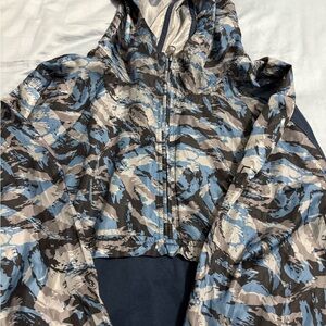 Under Armour Blue and Gray Camouflage Hoodie.  Top is like a wind breaker.